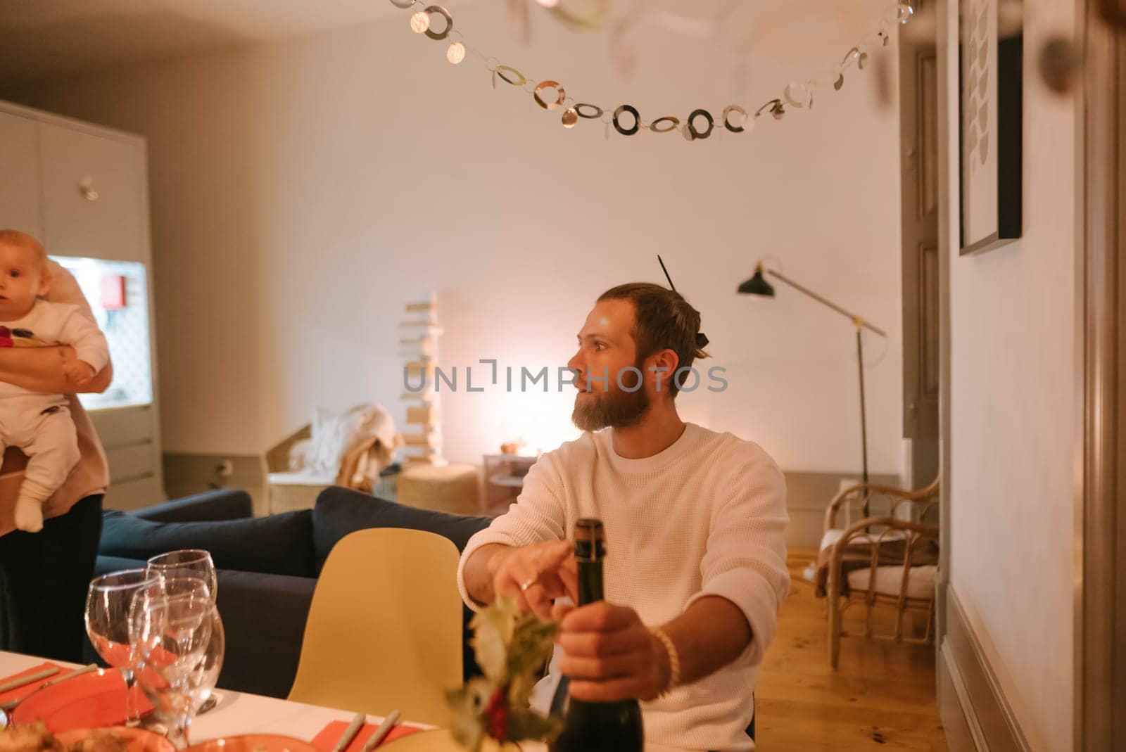 A warm moment of celebration with family, capturing laughter and connections shared over cozy drinks