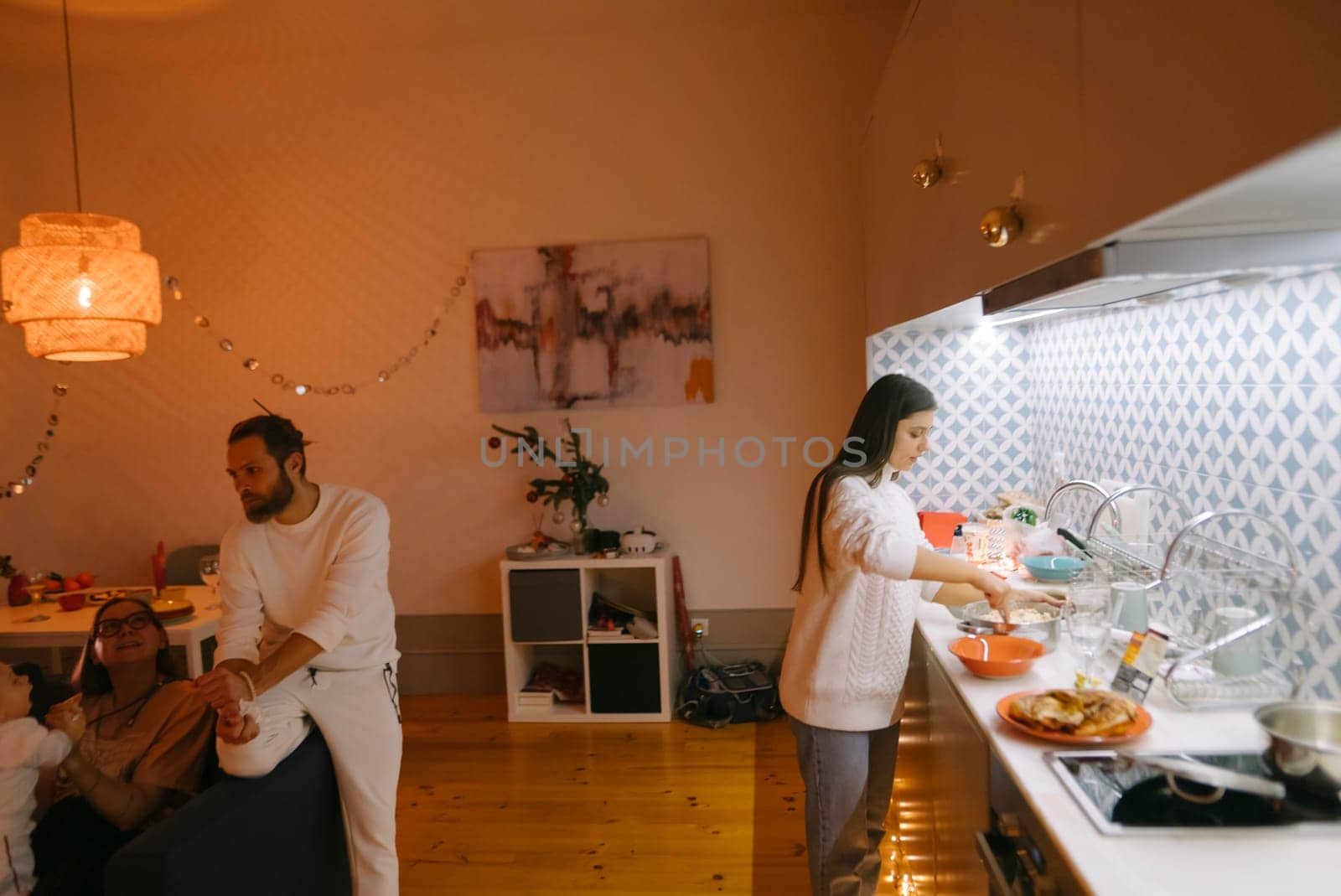 A warm and cozy kitchen scene showcasing family bonding as they cook together and also enjoy delightful meals