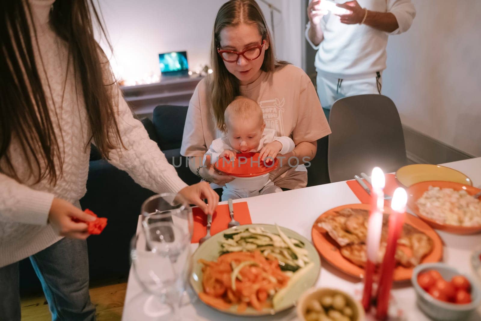 A warm family gathering around a beautifully set table with delicious homemade dishes and joyful celebrations