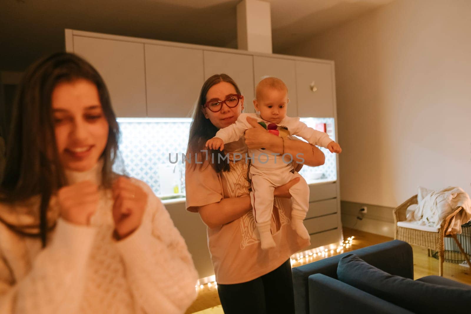 A heartwarming family scene featuring a loving mother and her child engaging playfully in a beautifully lit living room