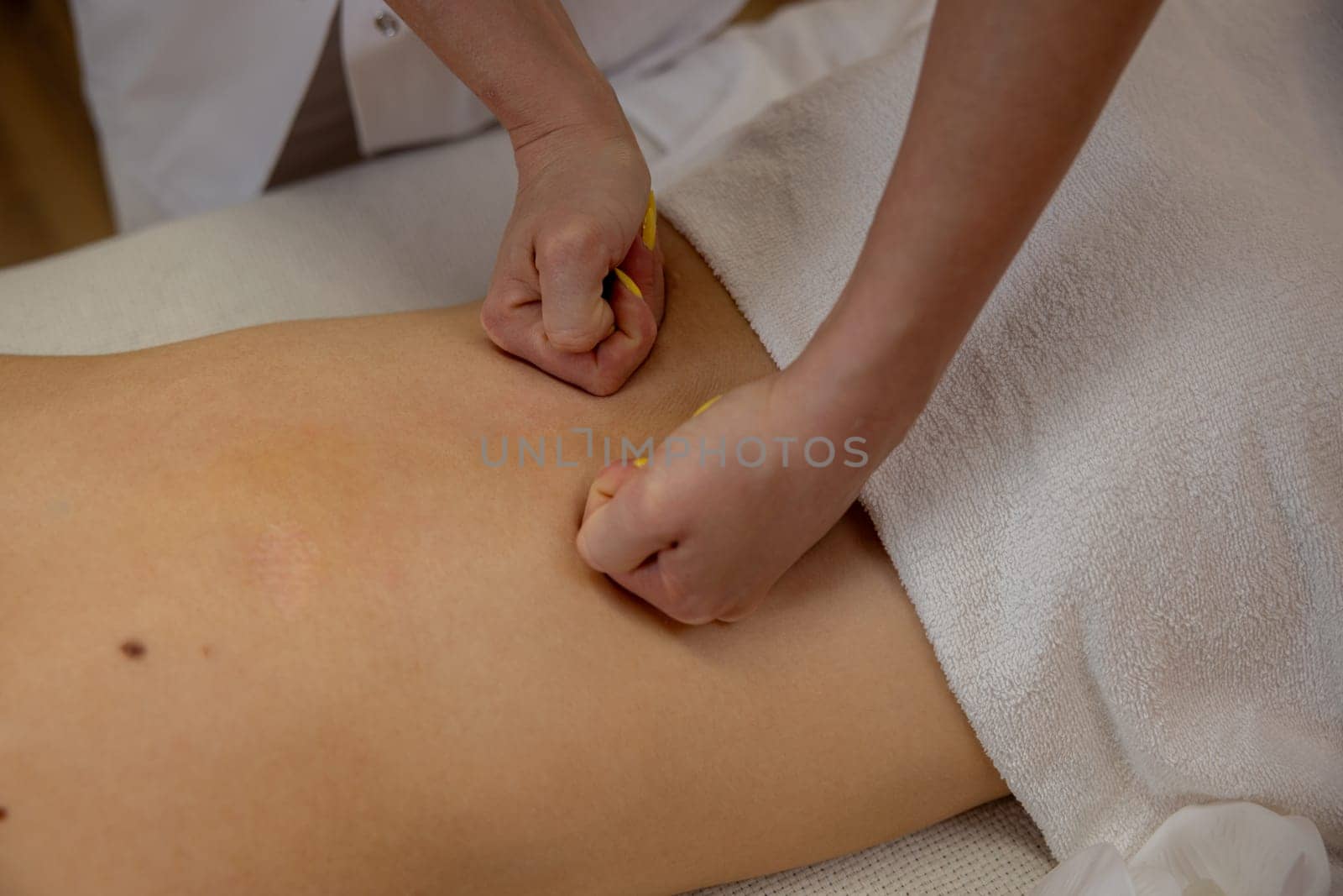 A highly skilled therapist skillfully applying targeted pressure during a soothing therapeutic massage session