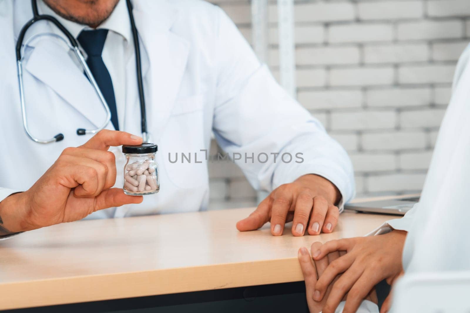 Doctor in professional uniform examining patient at hospital Jivy by biancoblue