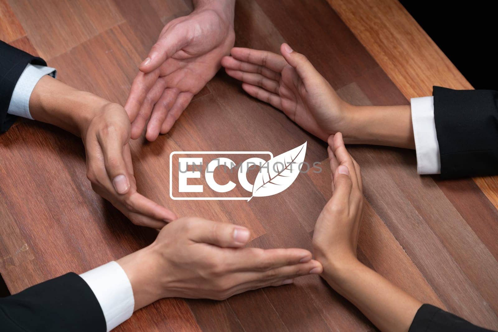 Top view group of business people forming circle hand together around ECO icon on meeting table as concept of corporate responsible for eco-friendly investment for greener community. Quaint
