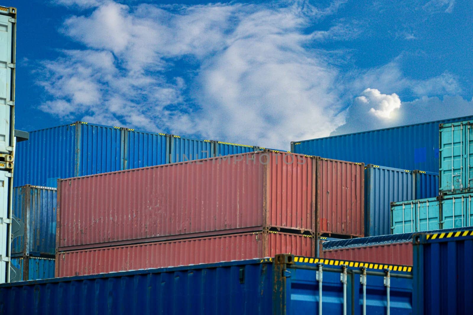 Image of large shipping containers stacked on top of each other. by boonruen