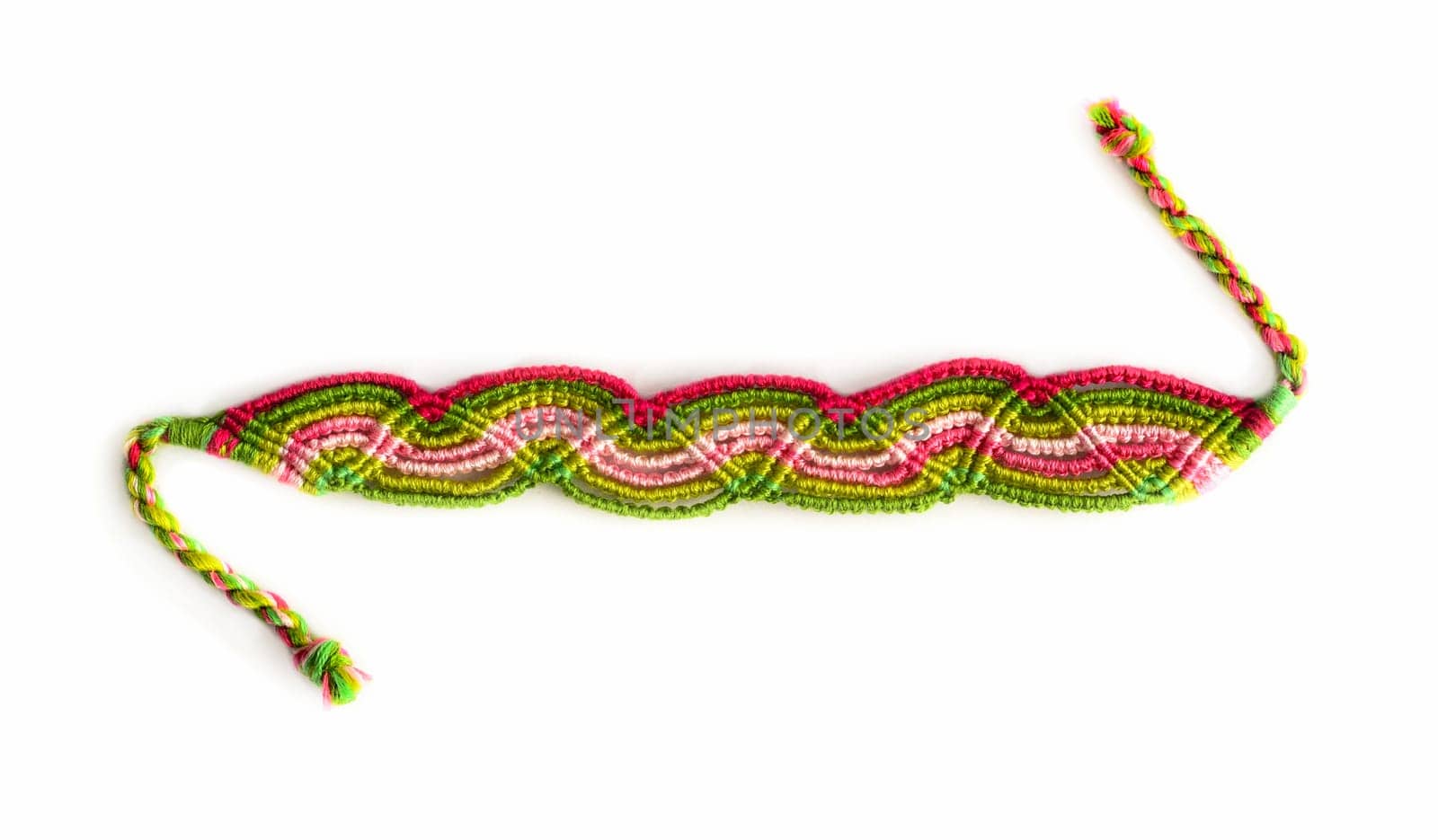 Multicolored woven DIY friendship bracelets handmade of embroidery bright thread with knots isolated on white background