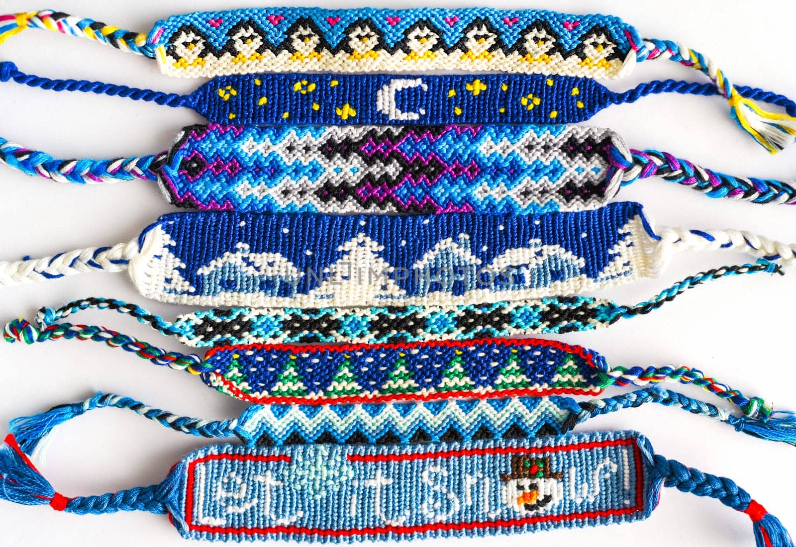 Woven DIY friendship bracelets handmade of embroidery floss with knots in blue style