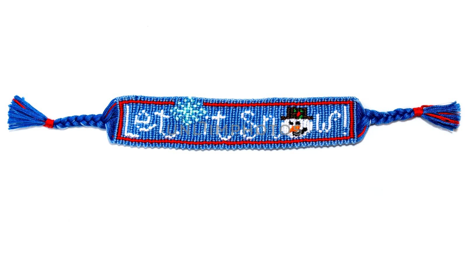 Woven friendship bracelet with Christmas alpha pattern Let it snow. Handmade of thread, isolated on white background. New Year DIY gift idea