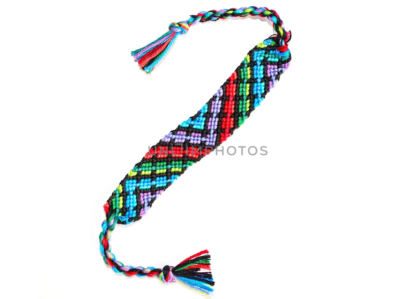 Multicolored woven DIY friendship bracelets handmade of embroidery bright thread with knots isolated on white background
