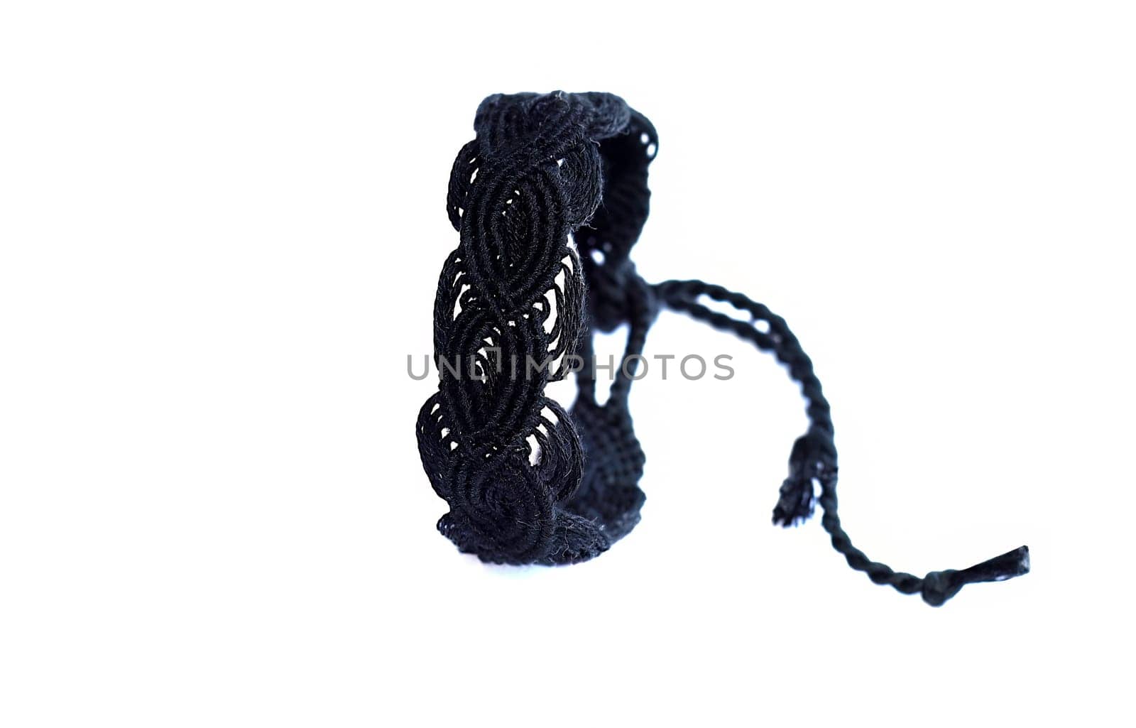 Multicolored woven DIY friendship bracelets handmade of embroidery bright thread with knots isolated on white background