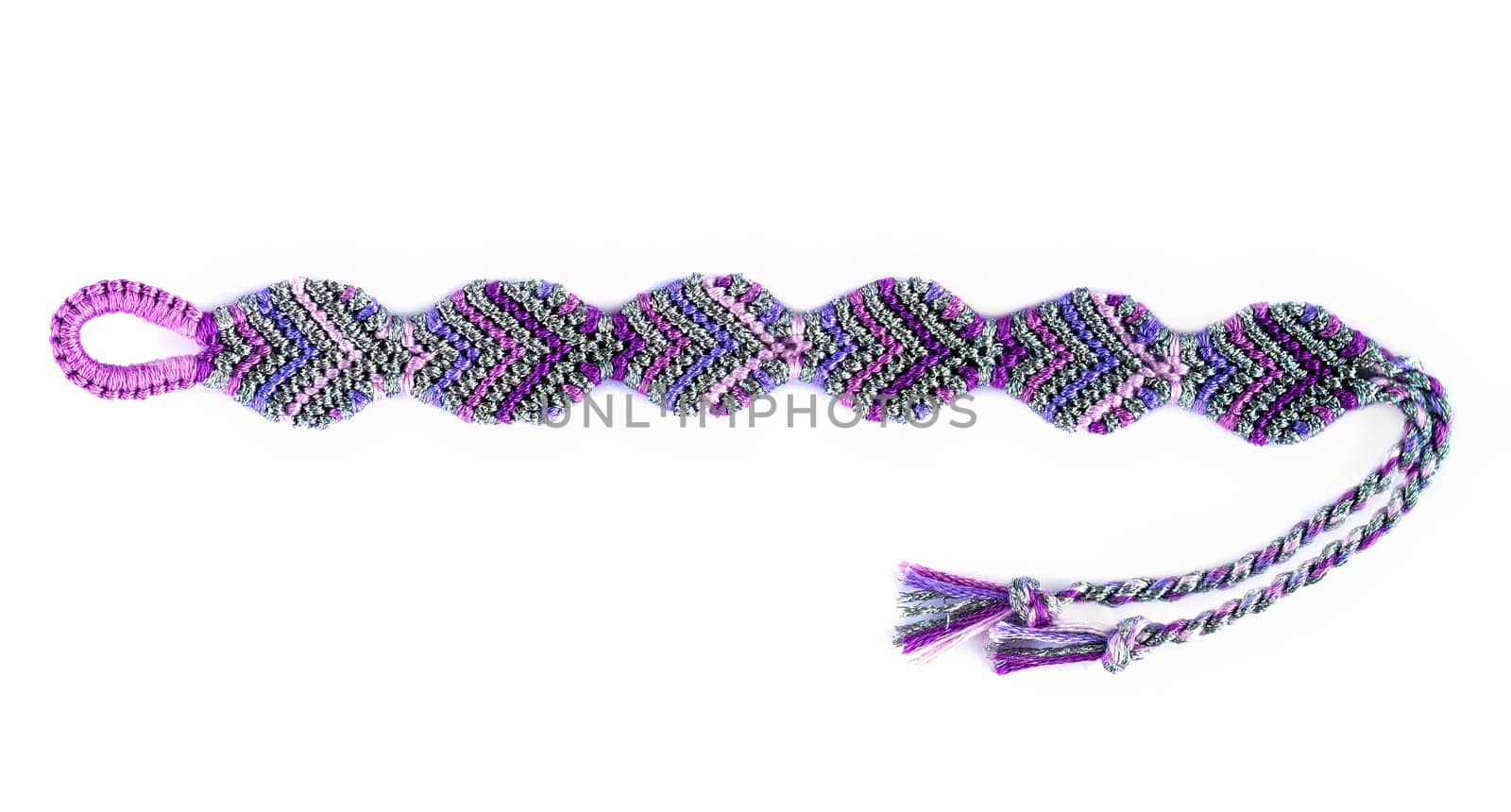 Multicolored woven DIY friendship bracelets handmade of embroidery bright thread with knots isolated on white background