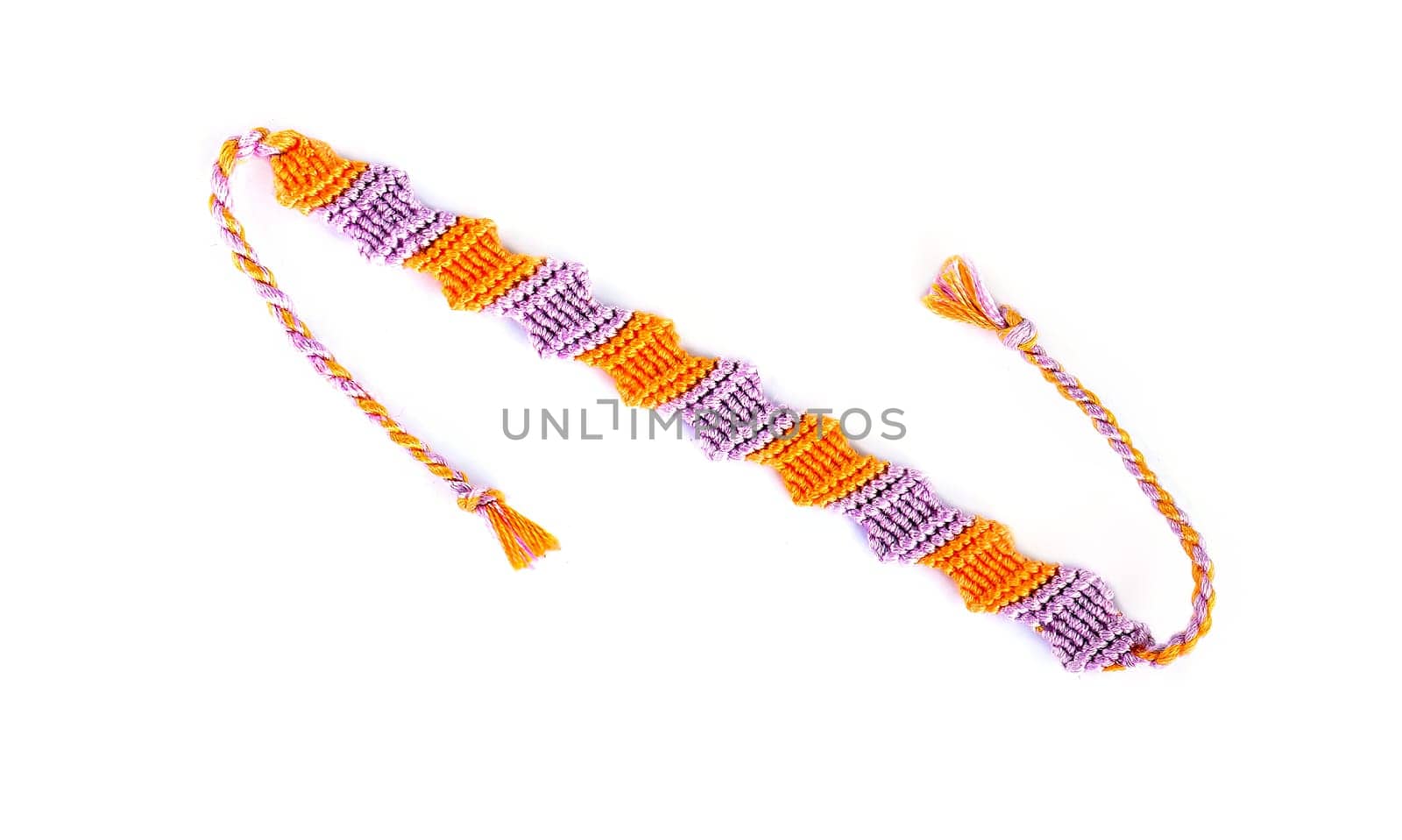 Multicolored woven DIY friendship bracelets handmade of embroidery bright thread with knots isolated on white background