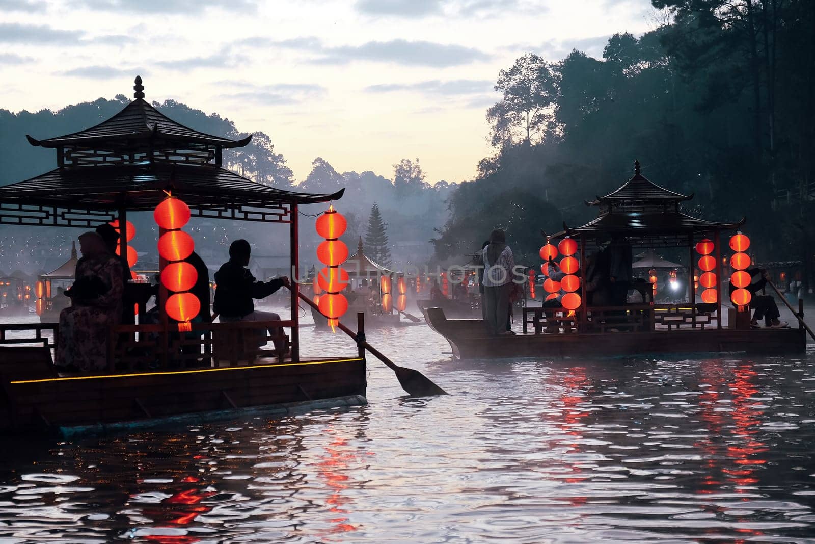 Boat trip on the lake in the morning at Ban Rak thai village in Mae Hong Son, Thailand