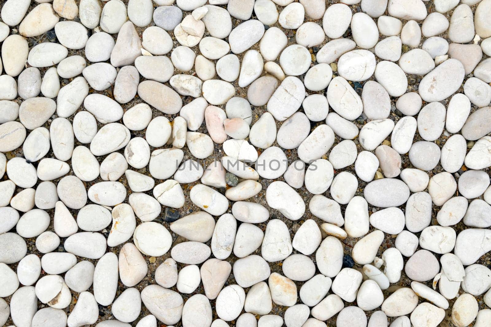 Background made of white smooth stones pebbles