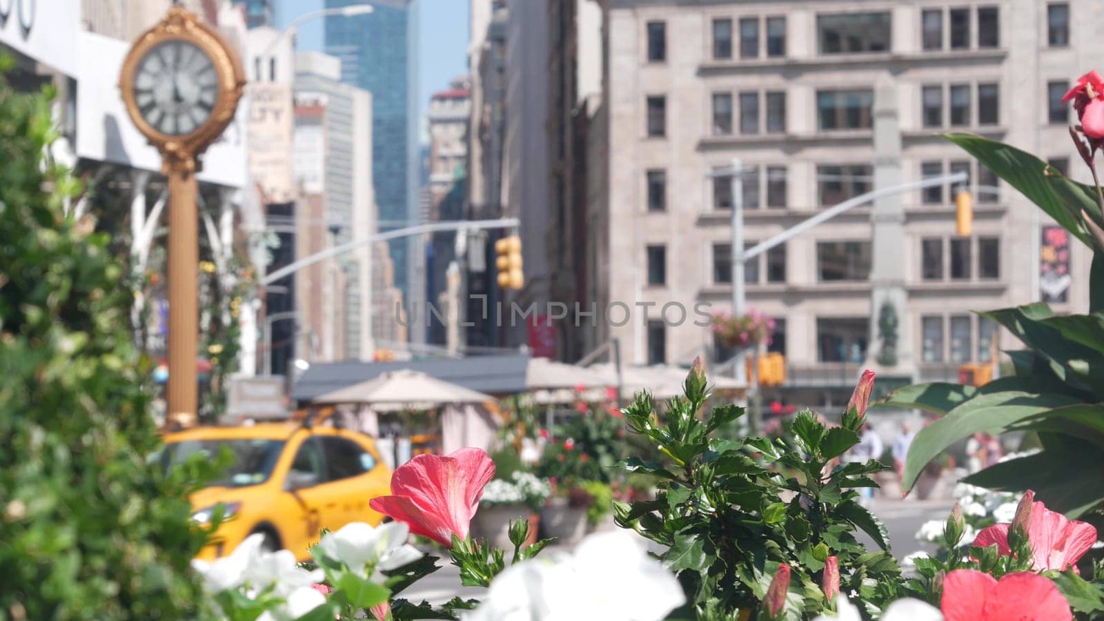 New York City, United States - 6 Sept 2023: Manhattan Midtown Broadway, 23 street, 5 avenue crossroad intersection. Worth Square near Madison Park and Flatiron Building, USA. Porcelanosa, taxi, clock.