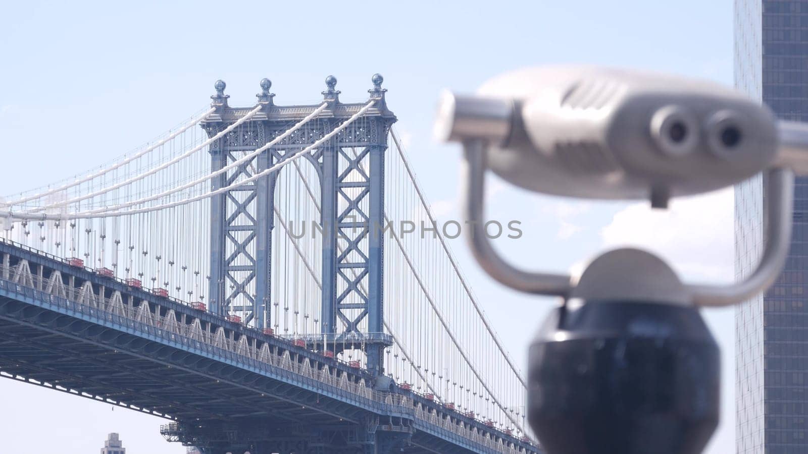 New York City, United States - 30 Aug 2023: Manhattan Bridge lookout, tower viewer binoculars, Brooklyn telescope viewpoint, Dumbo tourist landmark. East River John street park promenade. Travel USA.