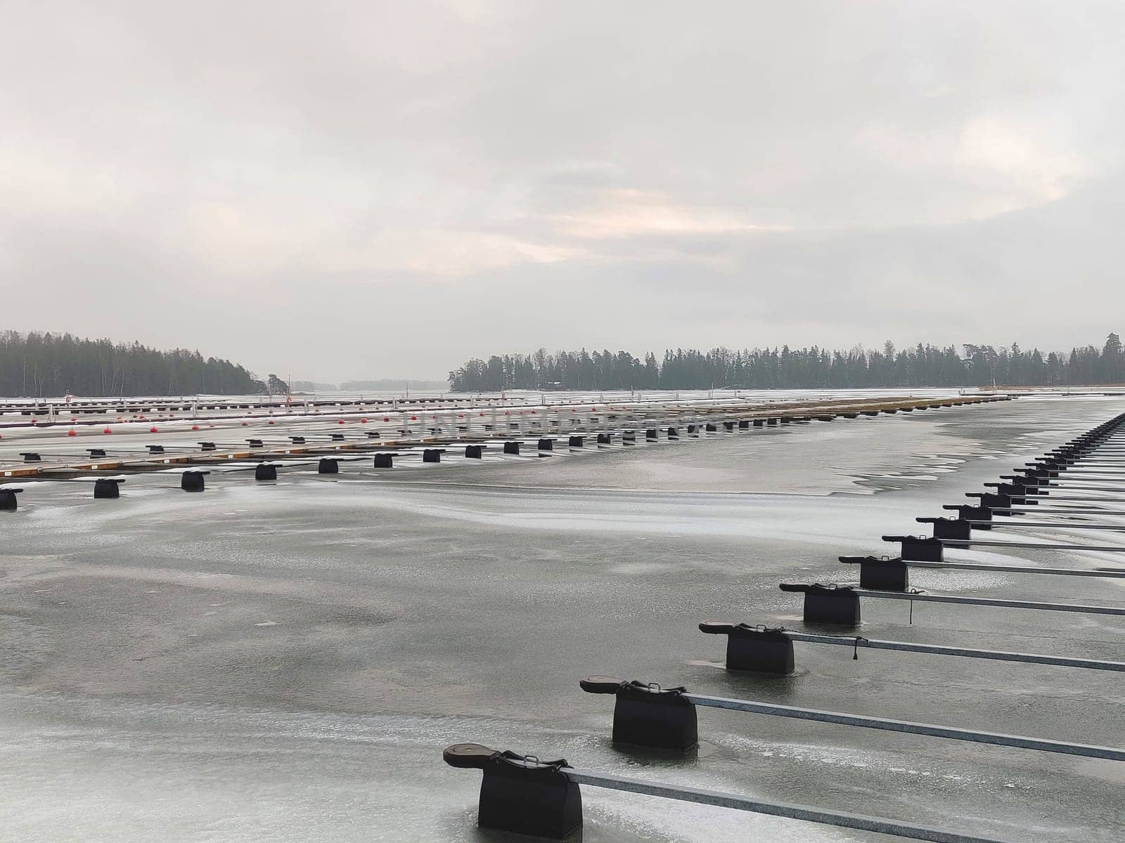 Sea marina at winter, iced Baltic sea, empty frozen harbor , winter season in Finland, marina Suomenoja, Finnoo, Northern country, cold conditions