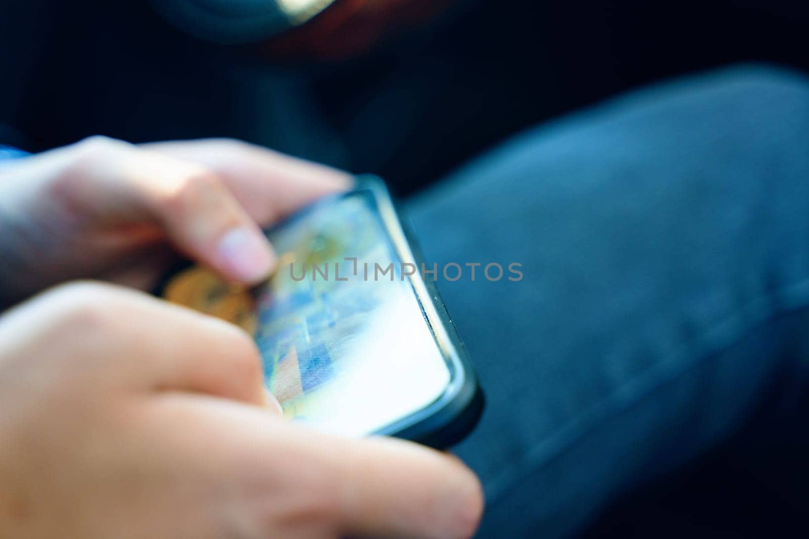 Mobile gaming concept. Man play phone. Man play mobile game in the home.