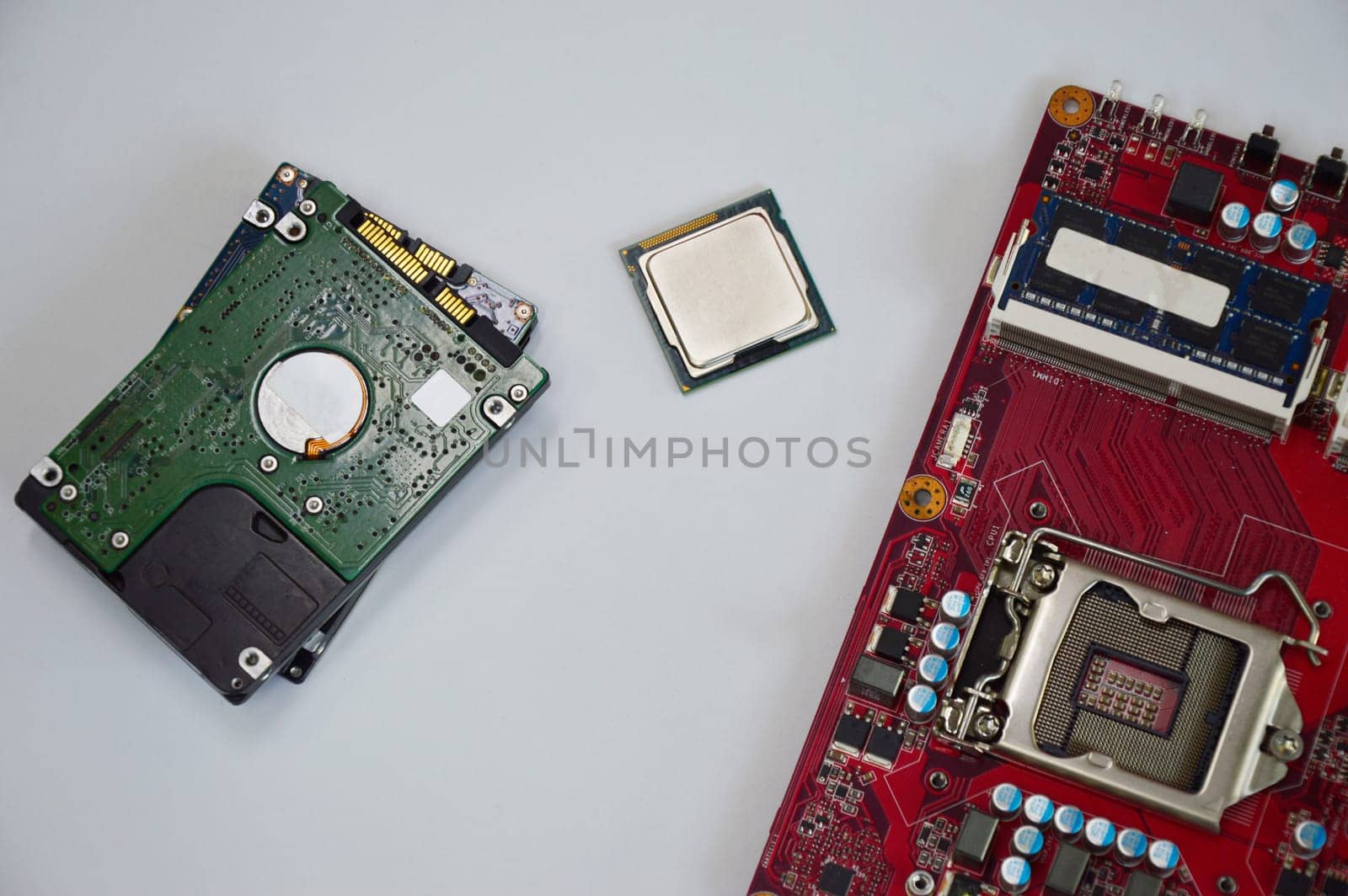 top view of computer equipment cpu harddisk motherboard messy place on a white background