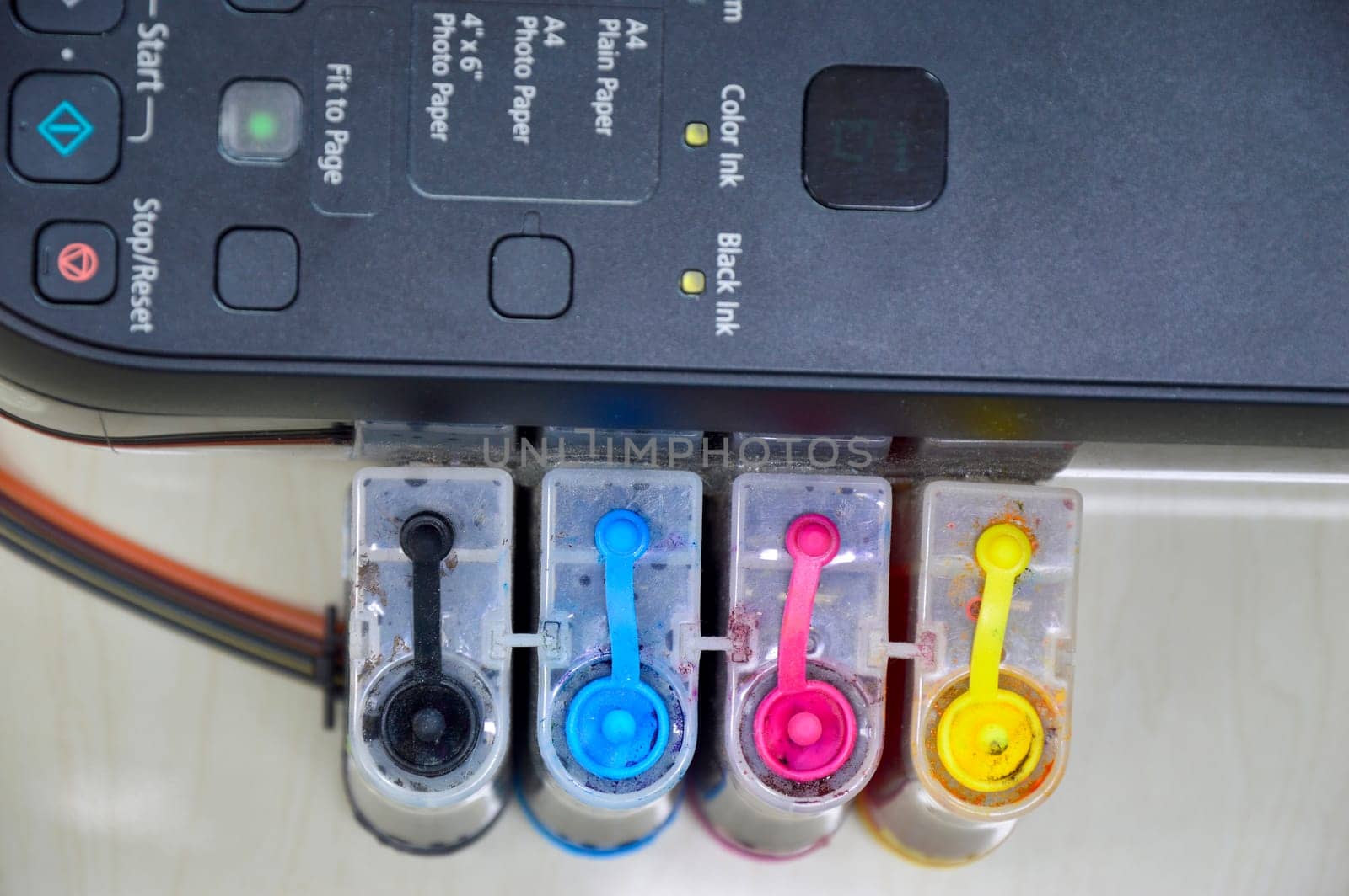 Top view of the printer's ink cartridge, available in 4 colors.