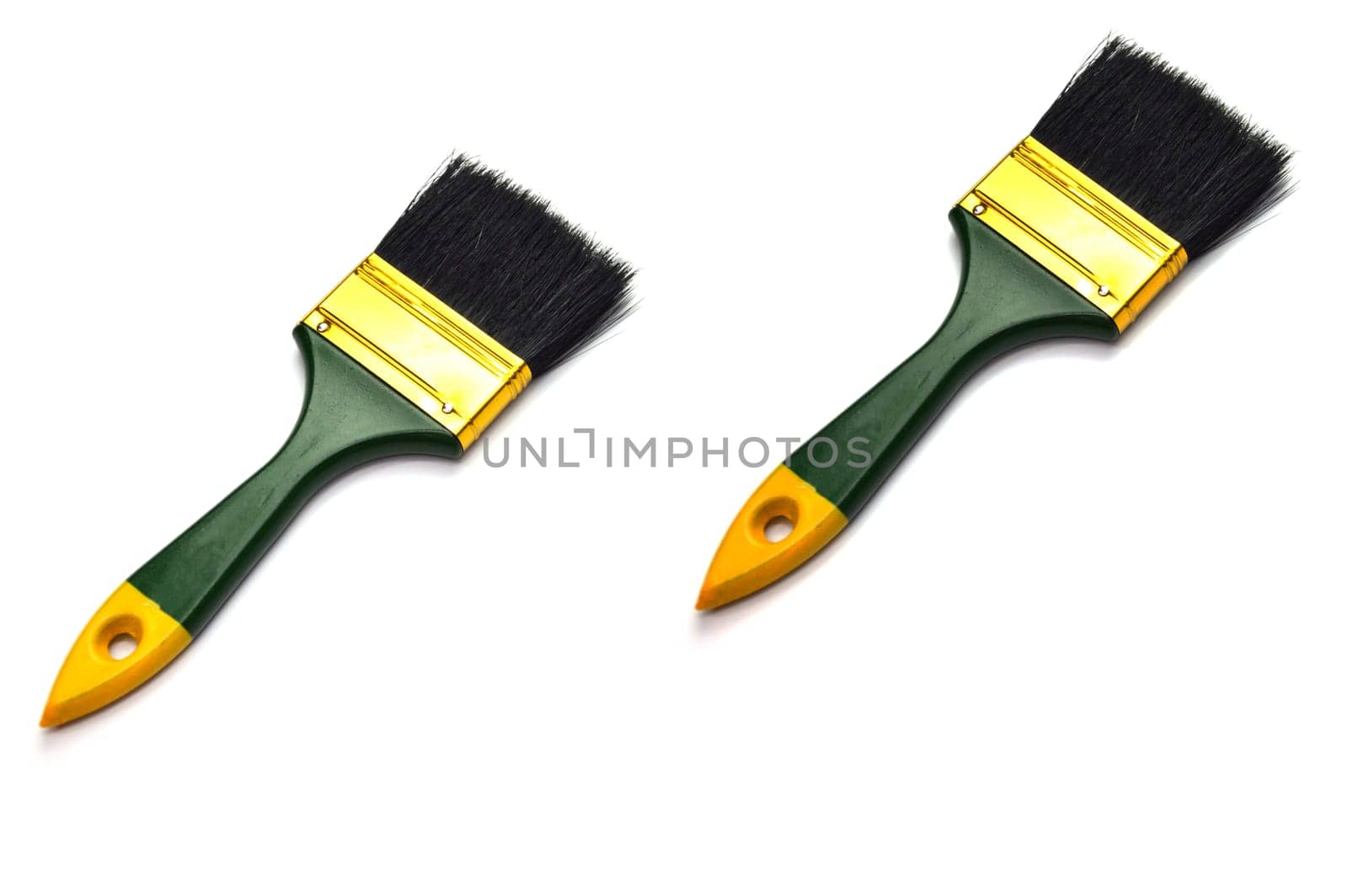 2 paint brushes placed on a white background