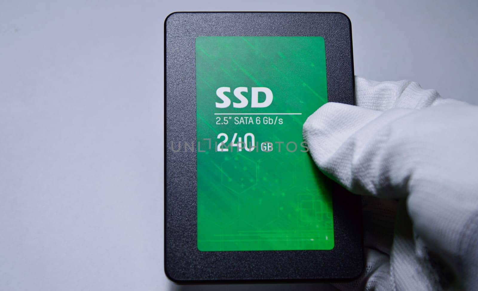 Close-up photo of 2.5" SSD hard drive, empty on white background.