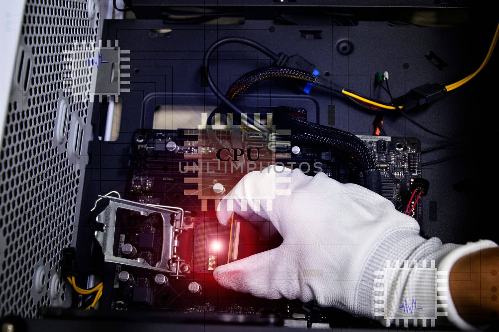 Image of a technician inserting a CPU chip onto a computer motherboard.