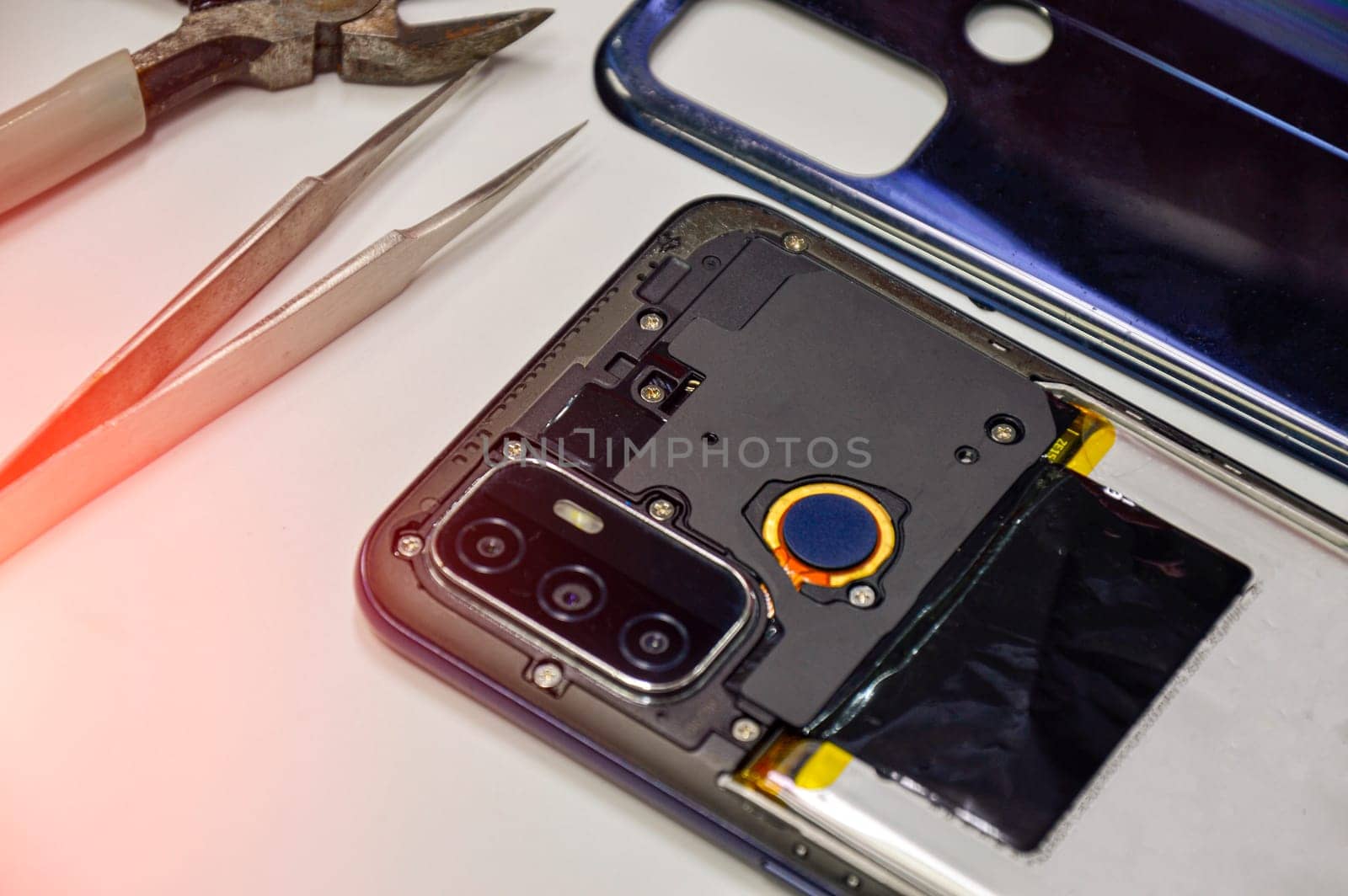The back corner of the mobile phone has been removed.
