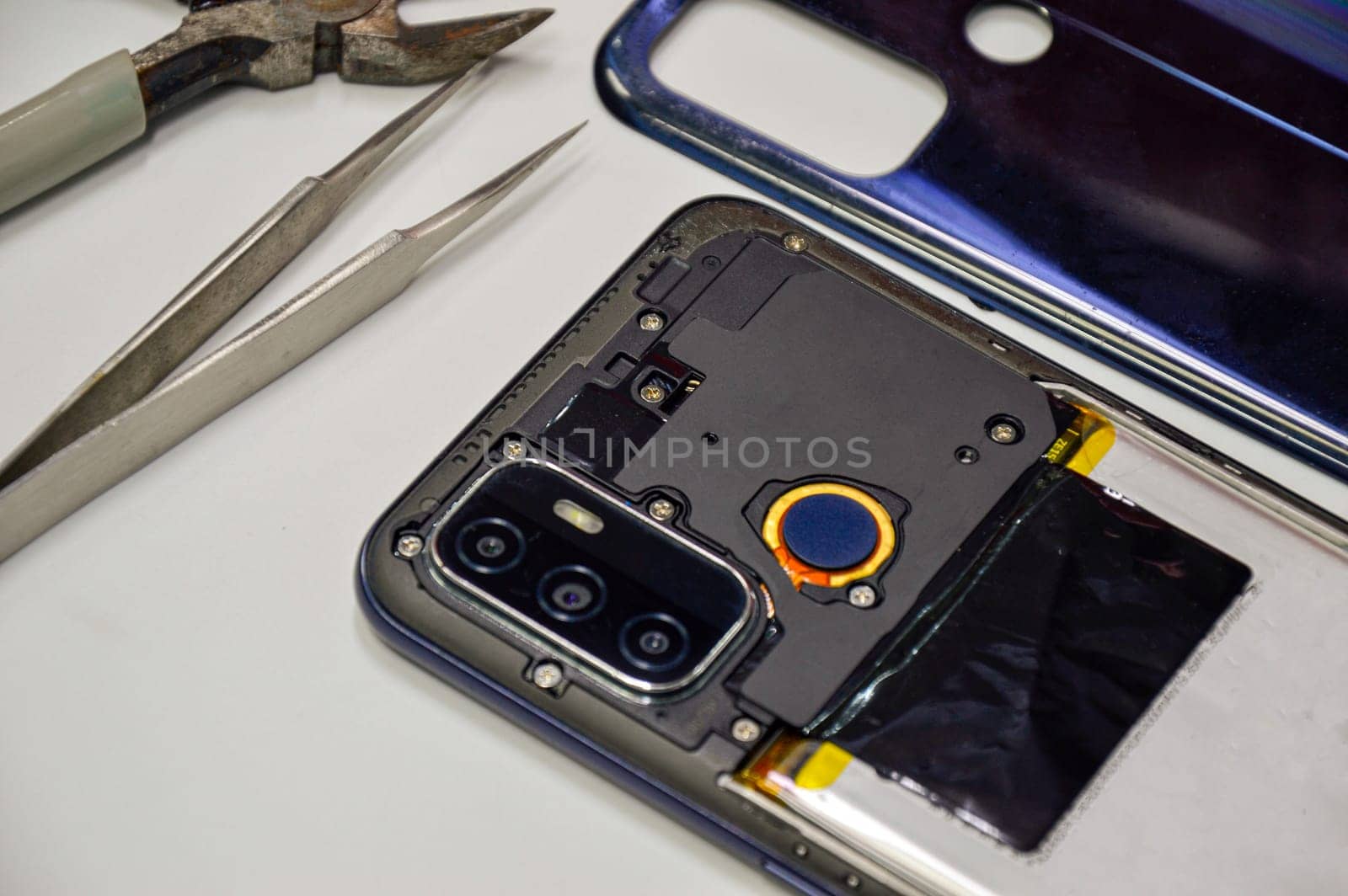 The back corner of the mobile phone has been removed.