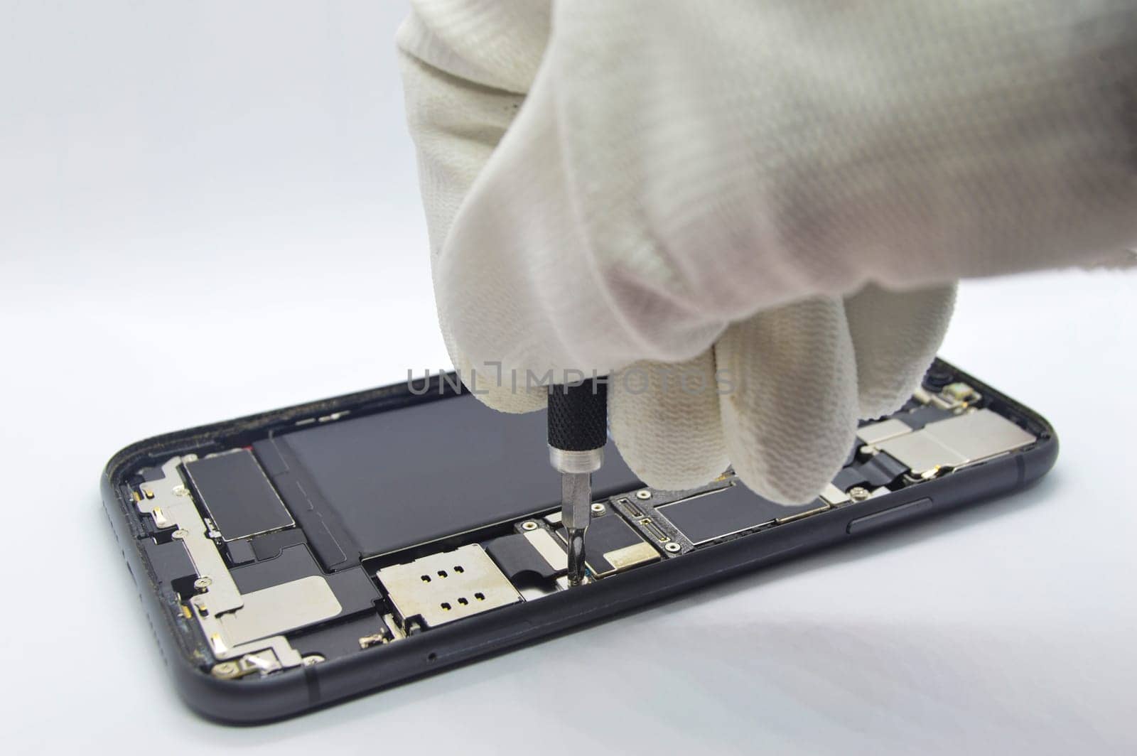 Close-up side view of an open cell phone (mobile phone repair)