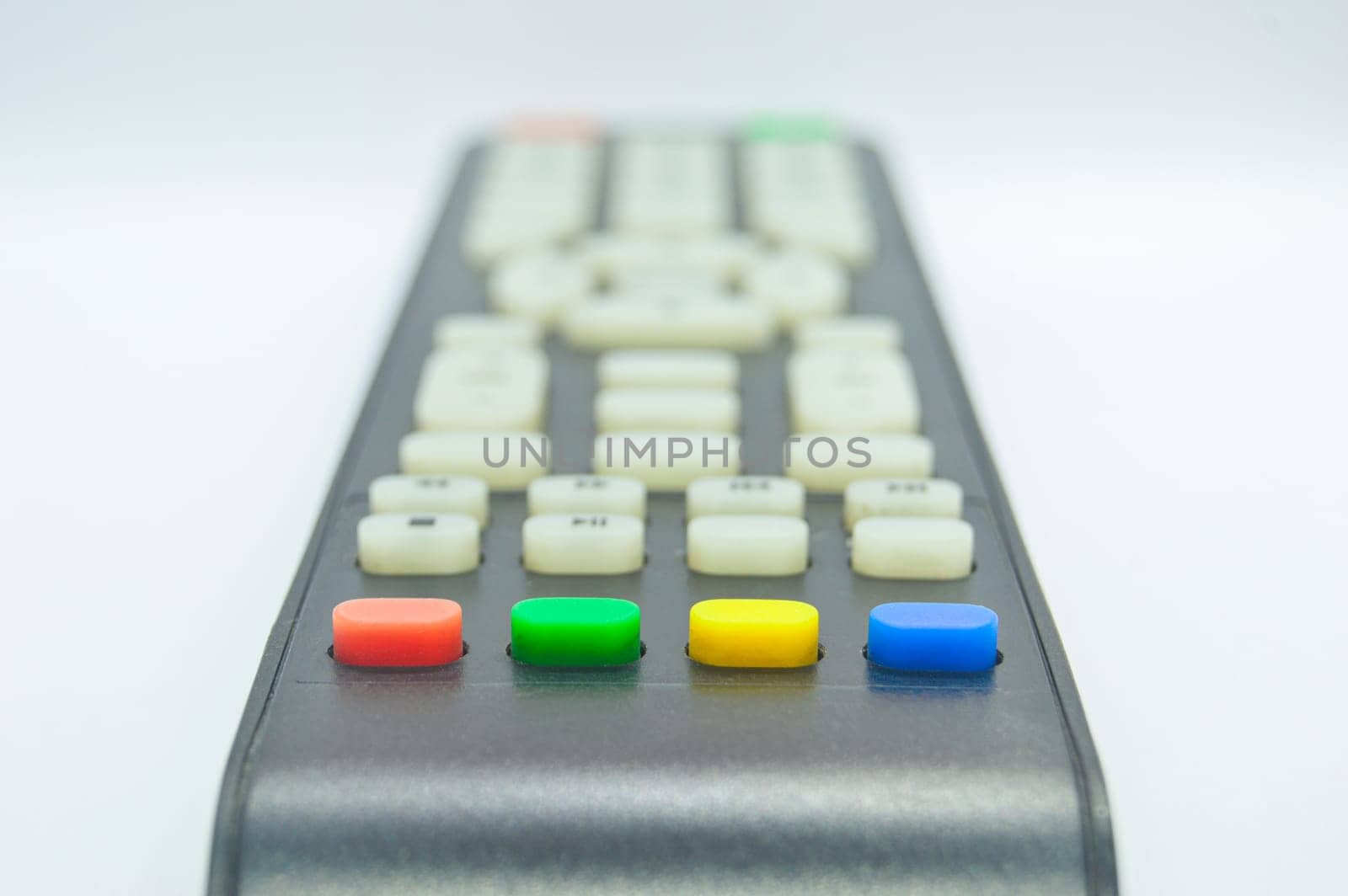 The bottom view of the remote control has four colored buttons.