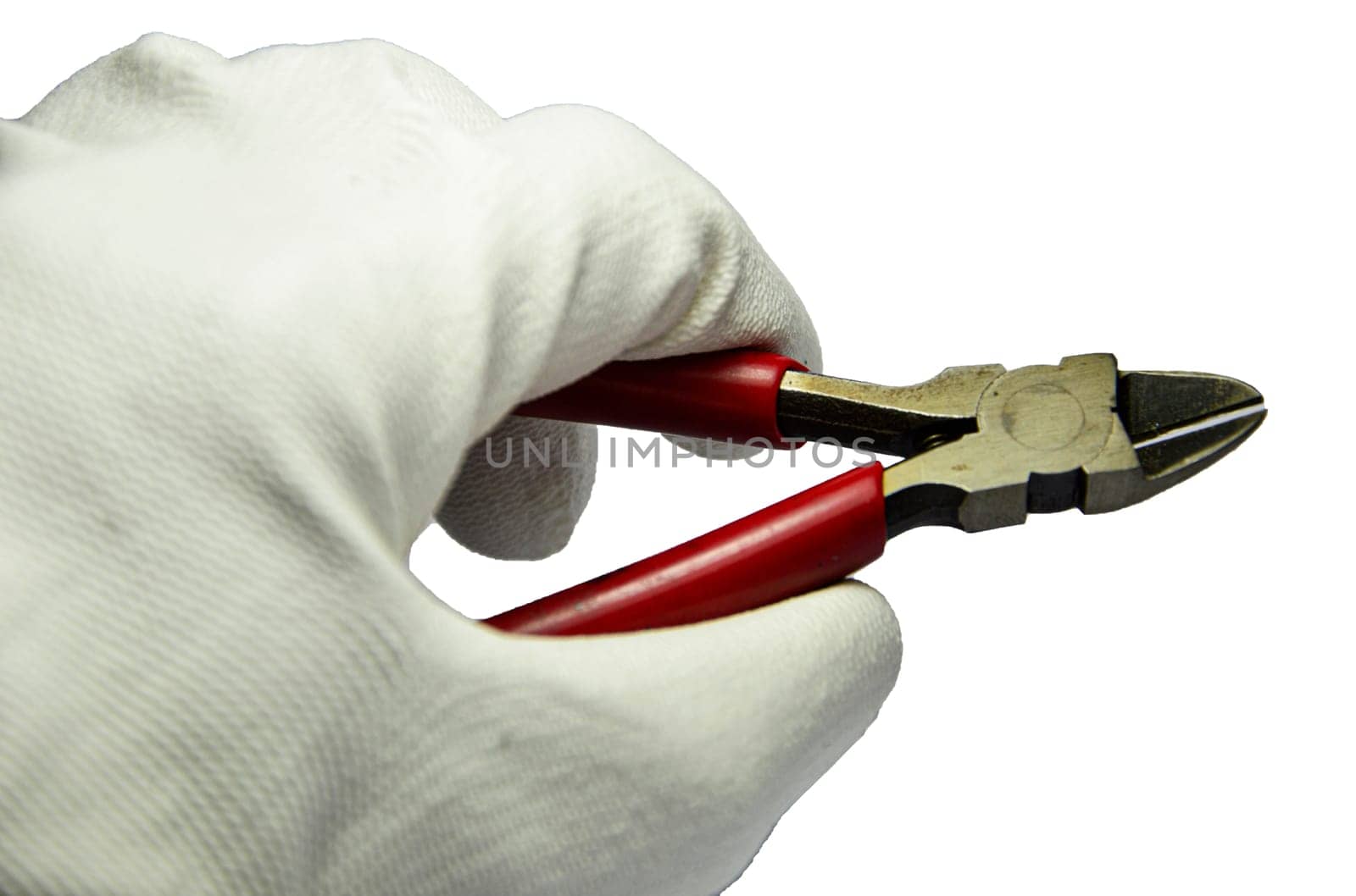 Hand holding the red cutting pliers (with clipping path)