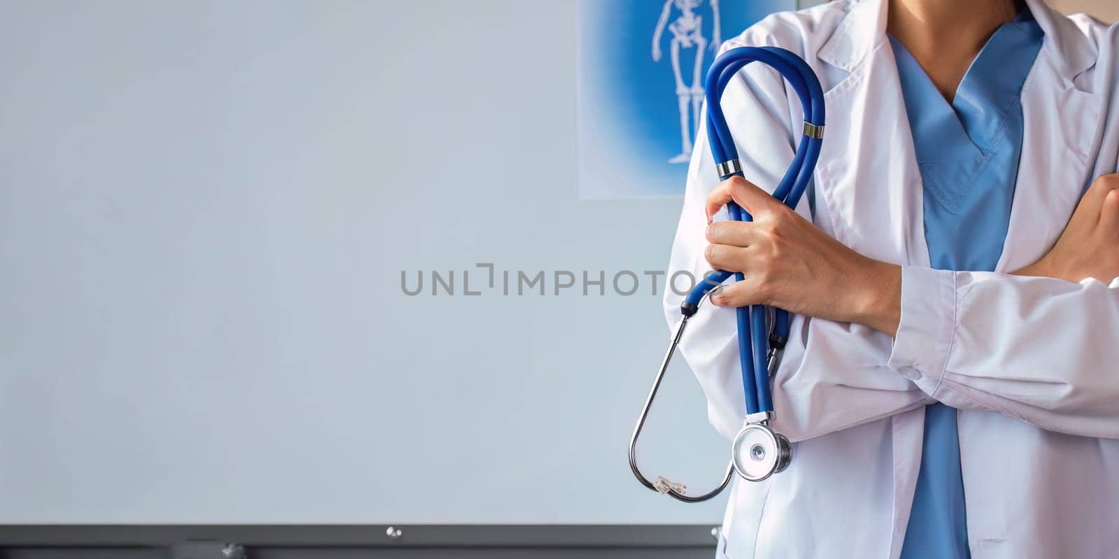 Medical concept of asian beautiful female doctor in white coat with stethoscope, waist up. medical by nateemee