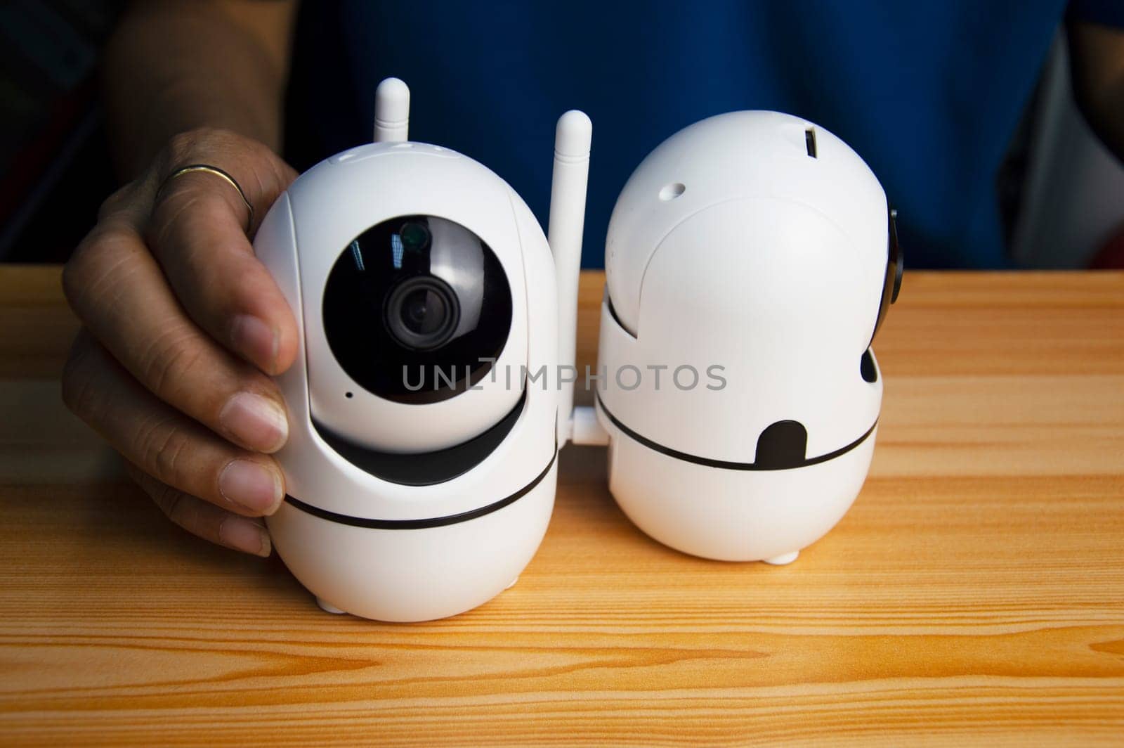 Conceptual man operating ip camera,White IP cameras, very popular for security purposes.