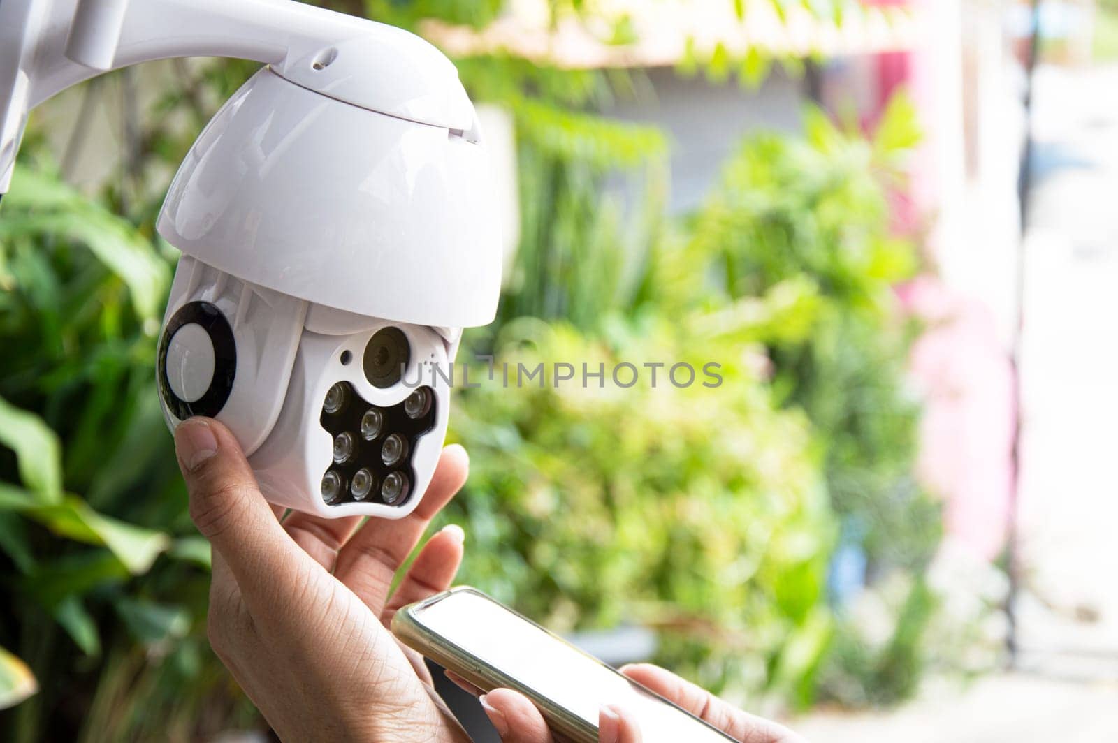 Man installing IP CCTV or high tech surveillance system CCTV system by boonruen