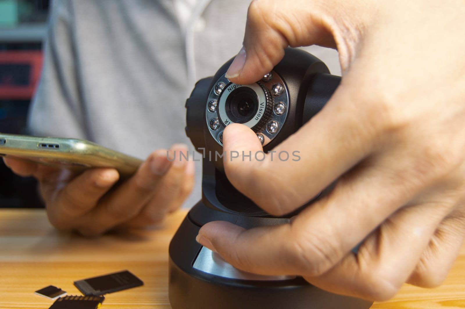 Conceptual man operating ip camera