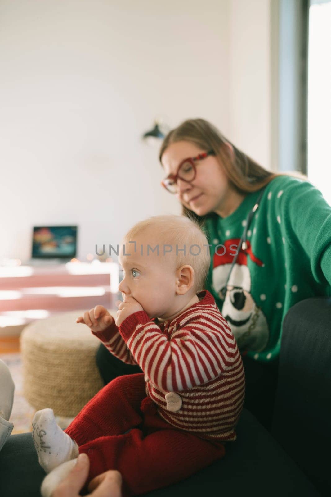 A warm bonding scene shows a child and an adult sharing joyful and affectionate moments in a festive setting