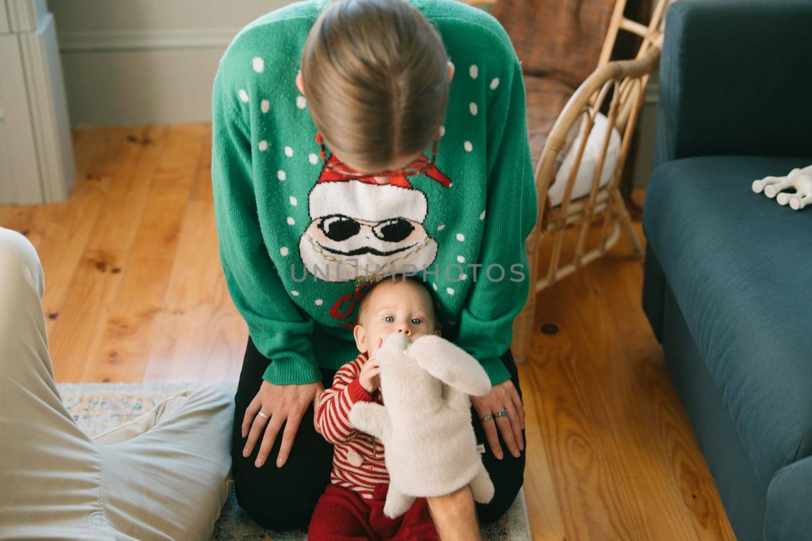 A heartwarming holiday scene with a loving caregiver and an adorable baby enjoying the festive season