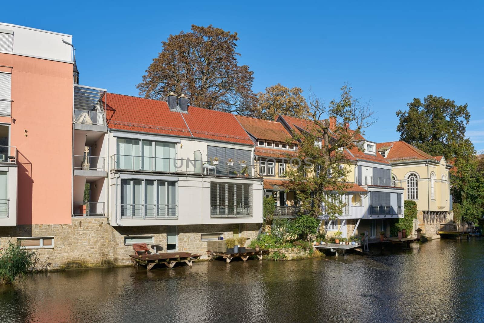 Idyllically situated residential buildings on the River Gera in the city center of Erfurt in the Thuringia region