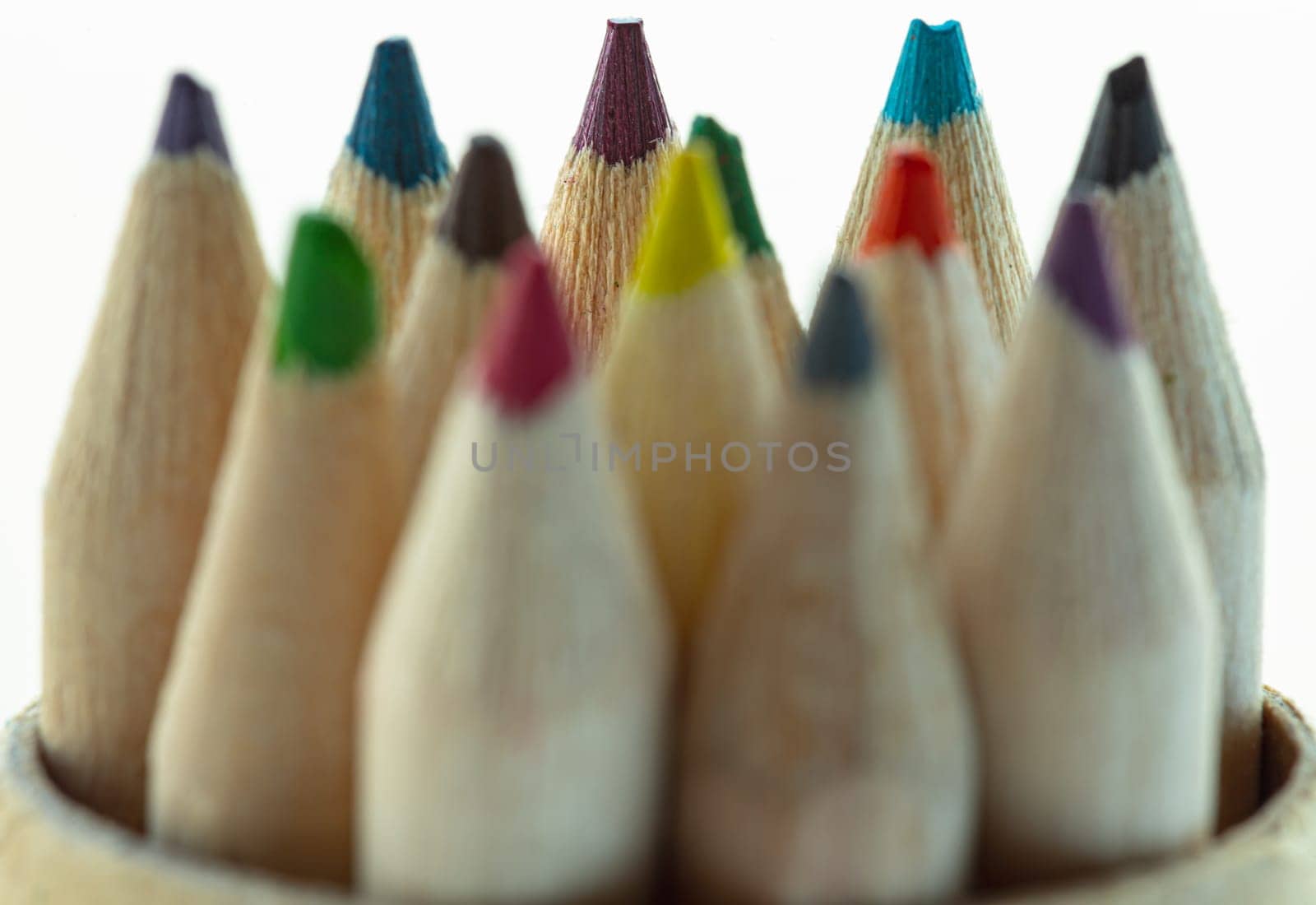 Close-up of group brown crayons or wood colors pencils with its sharpened tip facing upward. An artistic display of colored pencils, Stationery for drawing, Minimalism art supplies concept, Empty space for text, design and wallpaper, Selective focus.