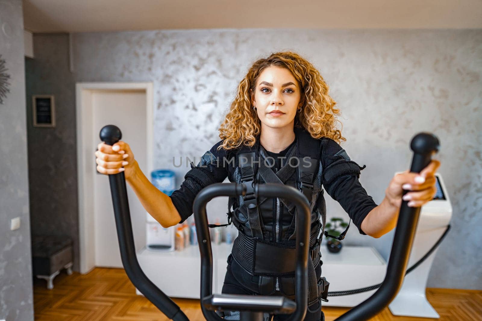 A person participates in an advanced fitness session in a modern gym.