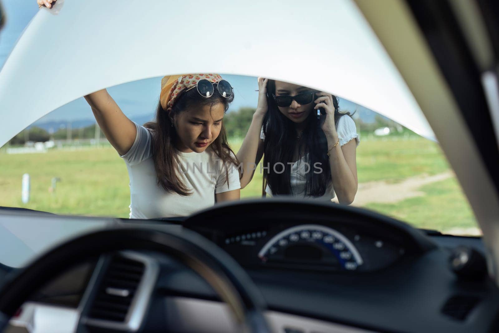 woman car engine problem on road trip or outdoor holiday travel journey by itchaznong