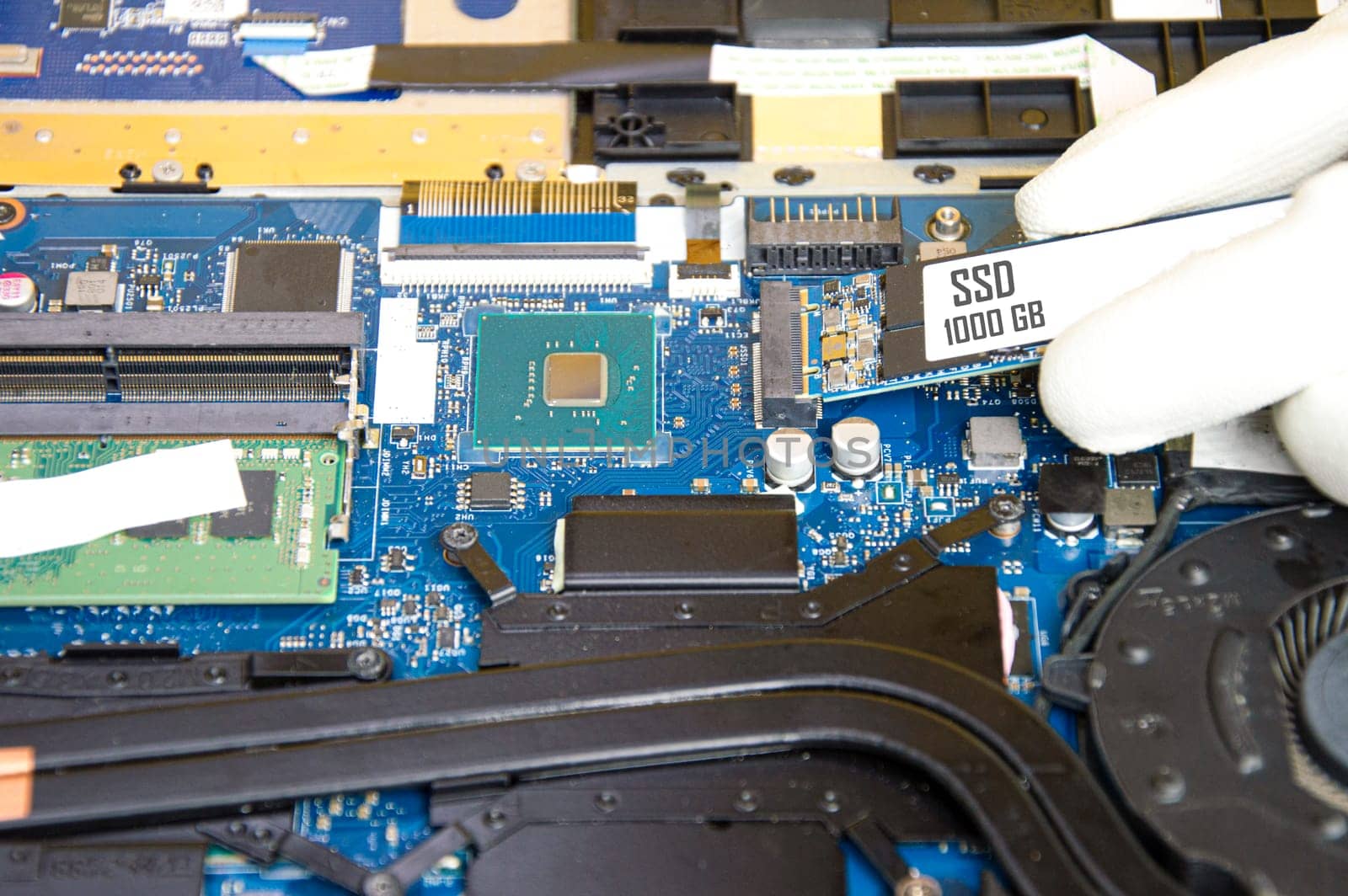 Top view of mechanic repairing computer, installing M.2 SSD by boonruen