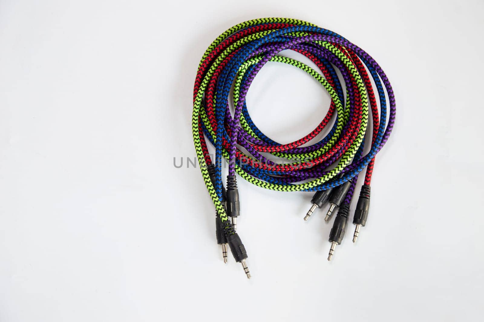 AUX audio cable on a white background by boonruen
