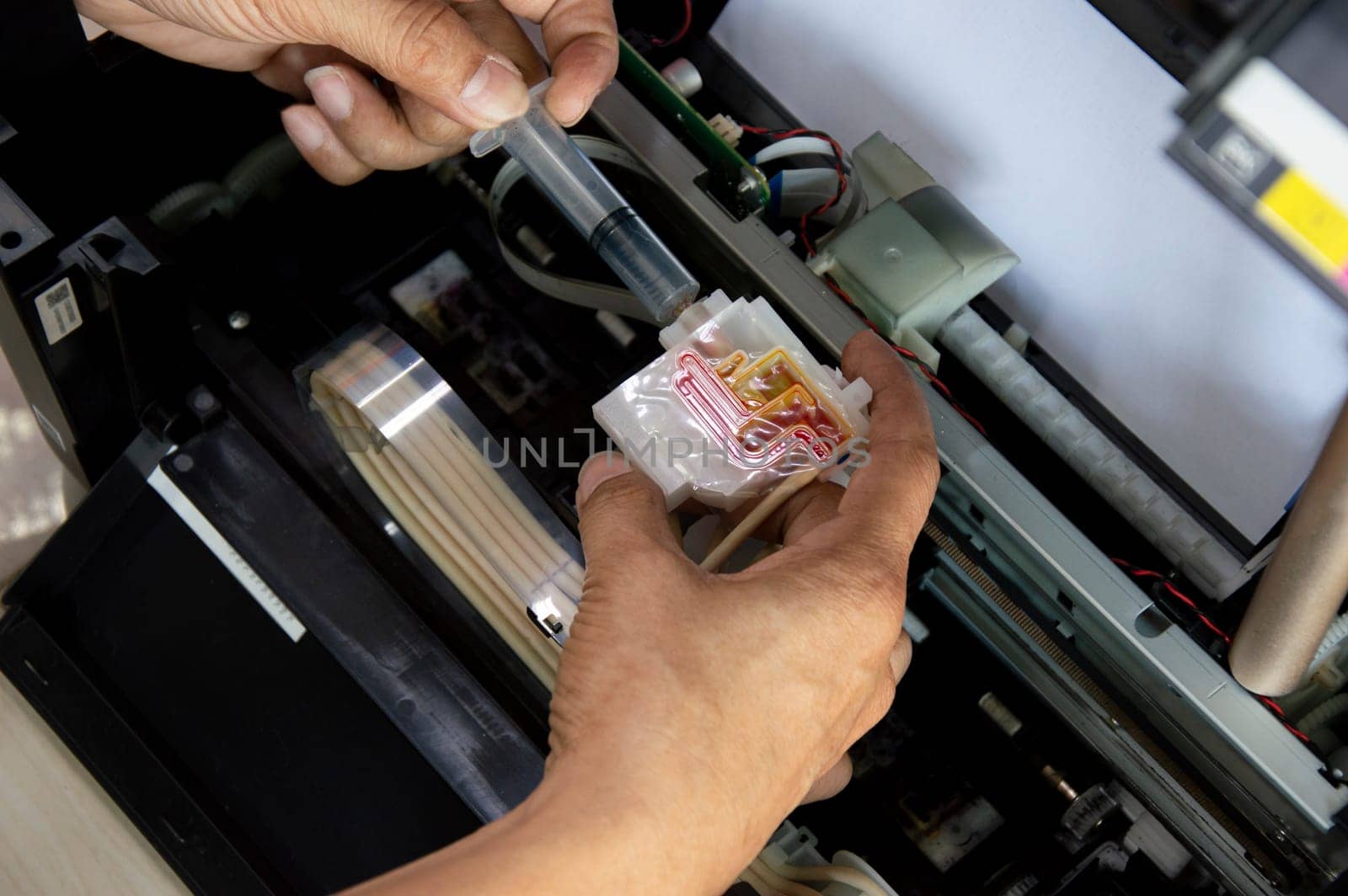 Top view inside the printer repairing a problem color. by boonruen