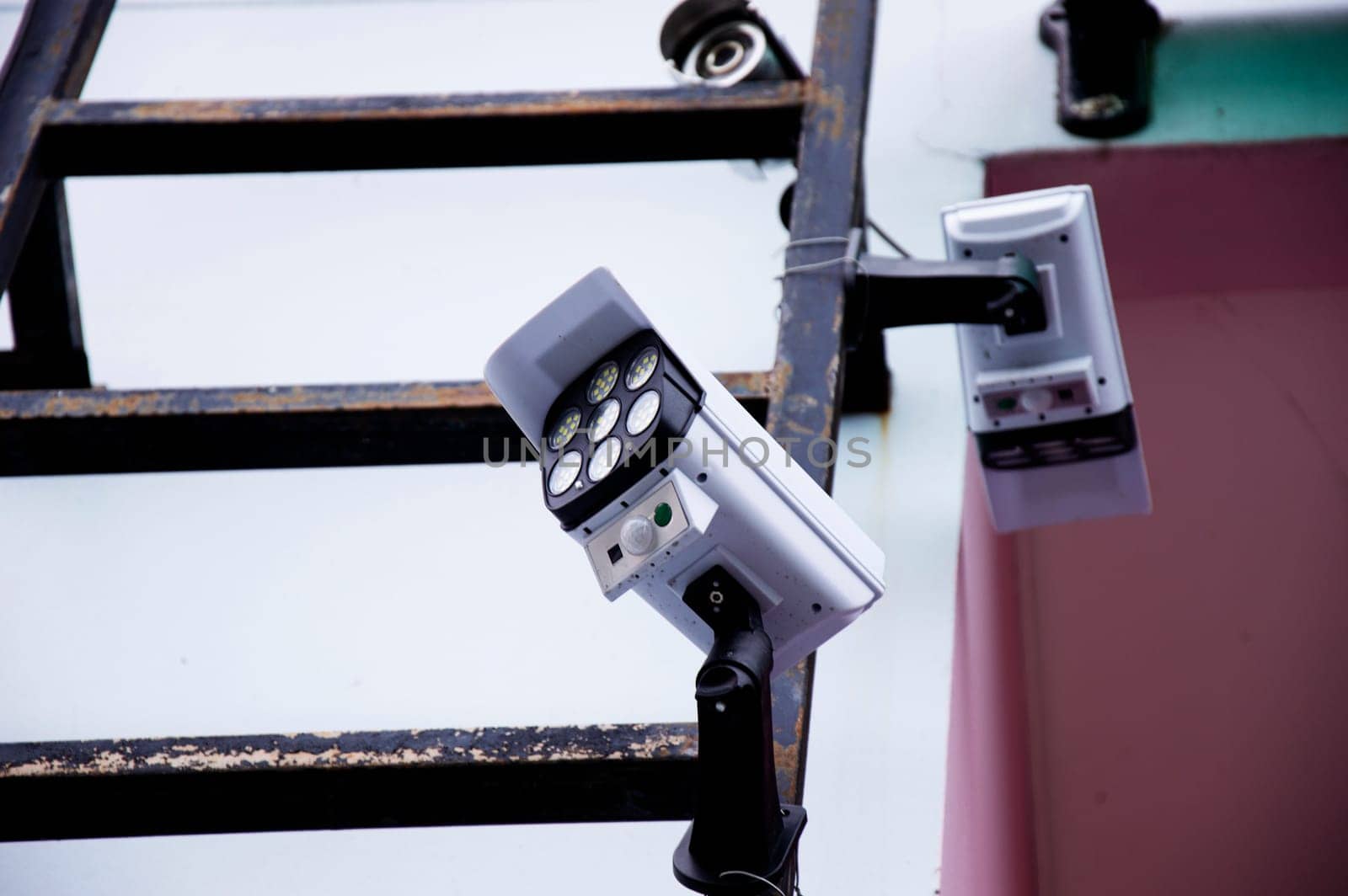 Bottom view of a solar bulb shaped like a surveillance camera