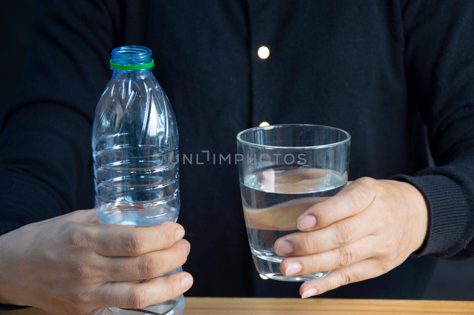 woman holding a glass of water The concept of drinking enough water every day for good health.