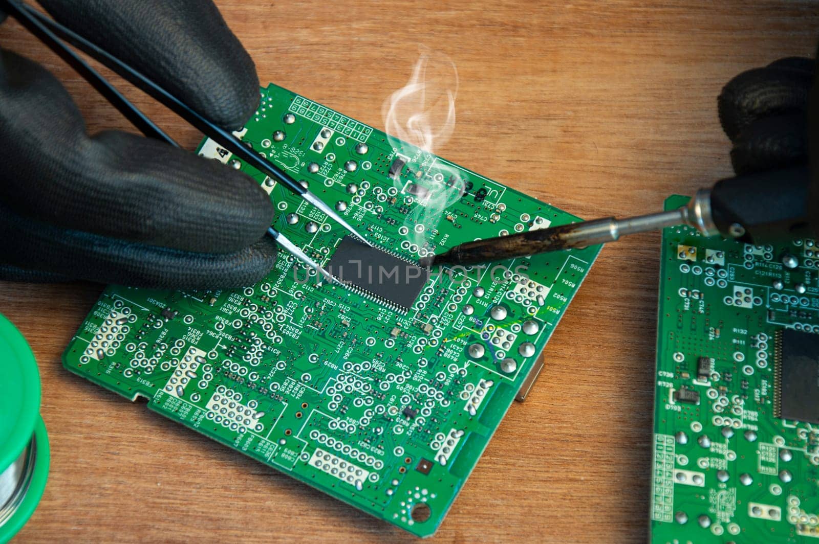Motherboard repair parts soldering male close-up
