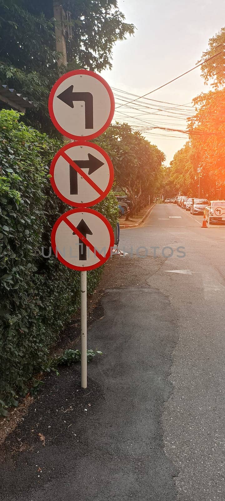 Traffic signs: Do not turn right, do not go straight, turn left.