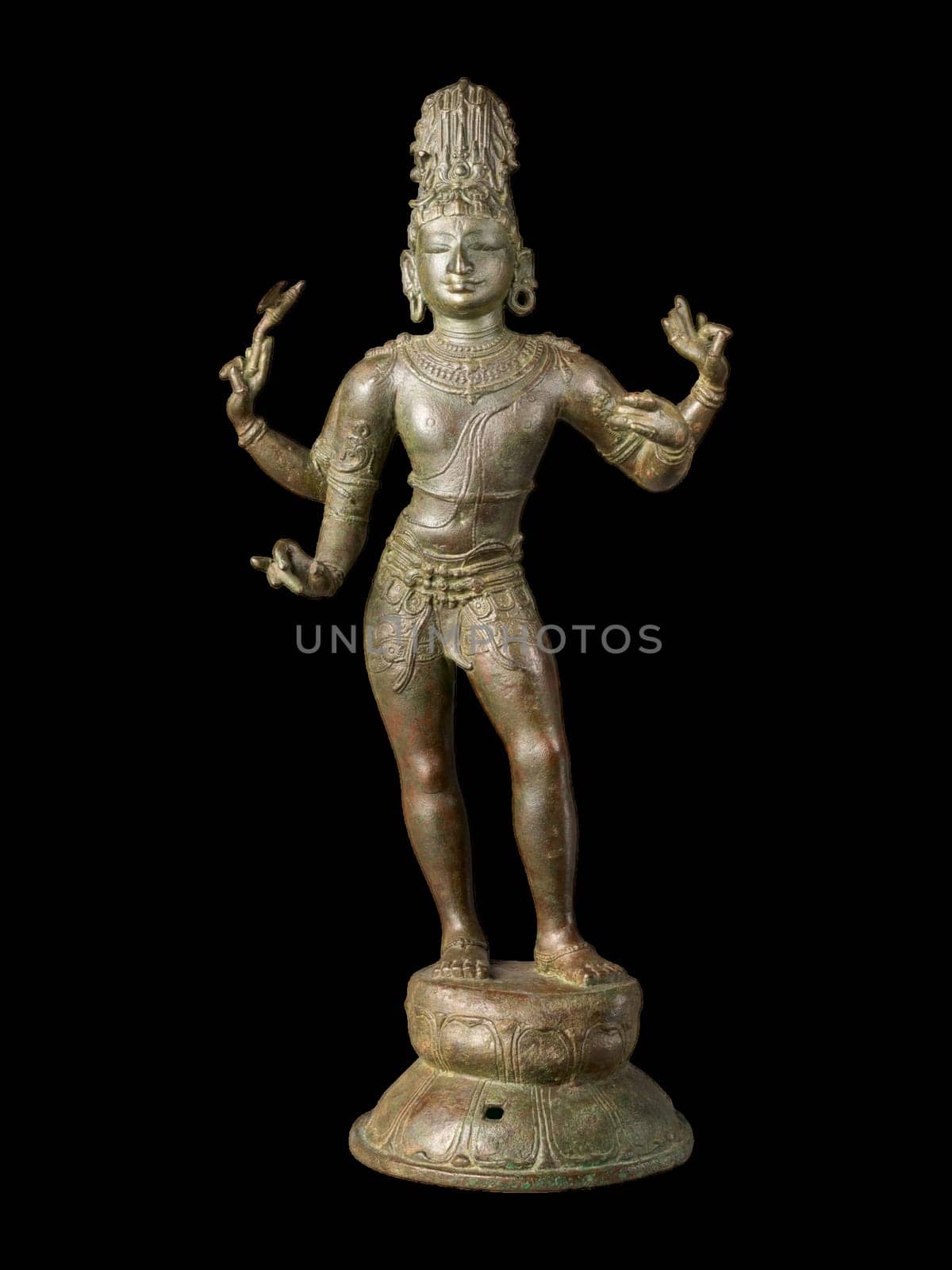 Ancient stone sculpture of Shiva as the Vanquisher of the Three Cities, showcasing intricate details and traditional hindu artistry from Tamil Nadu, India.