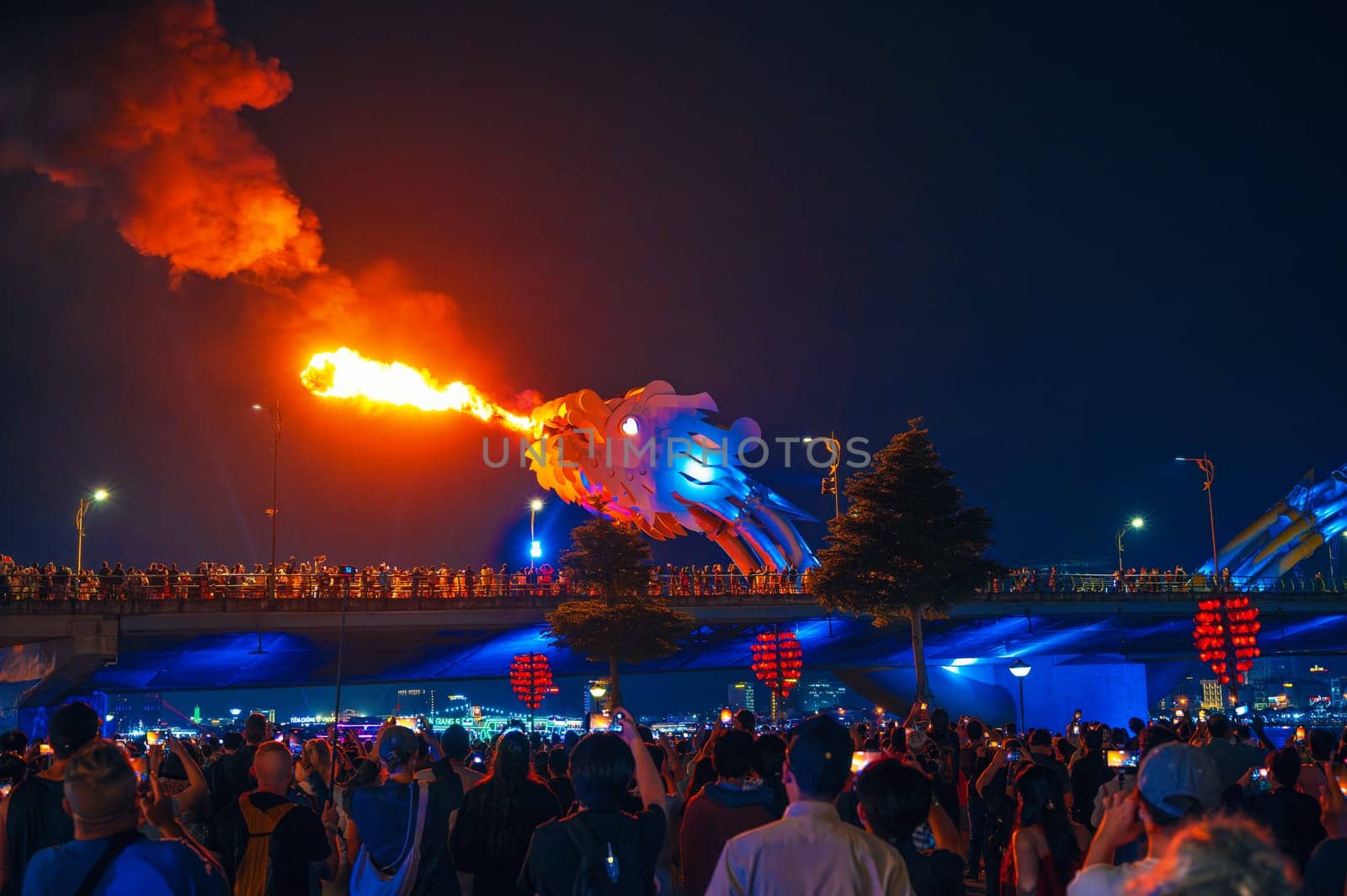 Fire show with flame on Dragon Bridge or Cau Rong Bridge in Da Nang in Vietnam in Asia at night. Da Nang, Vietnam - November 29, 2024